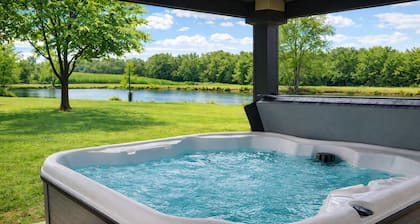 Relax at this peaceful two home countryside retreat with a private hot tub, pond views, 2 fire pits, and fishing for cozy comfort and country charm for everyone.