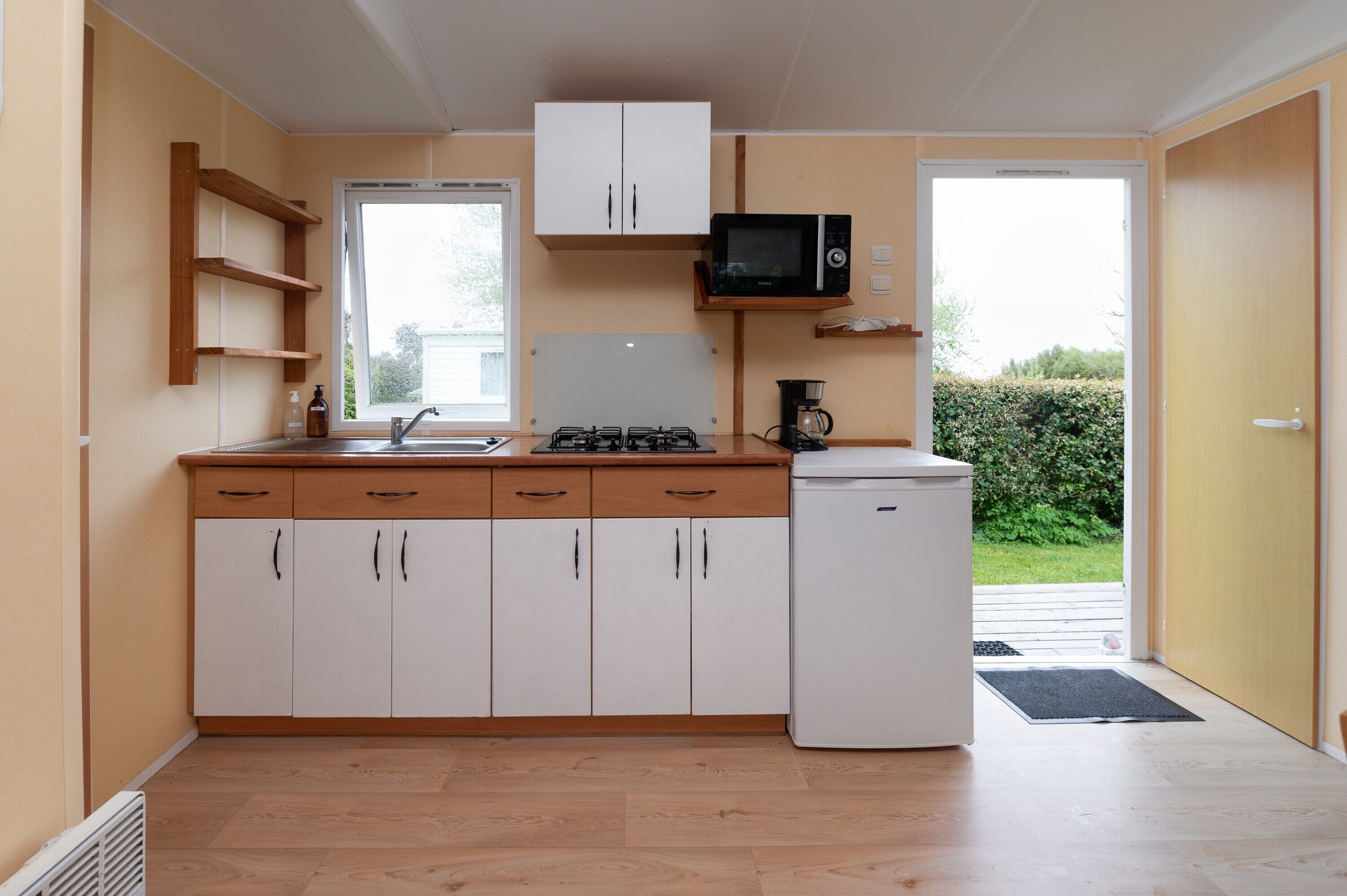 Fridge, microwave, stovetop, coffee/tea maker