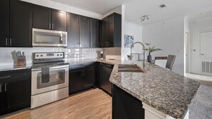Fridge, dining tables - Landing | Spectacular 2BD, Courtyard, Pool (Austin)