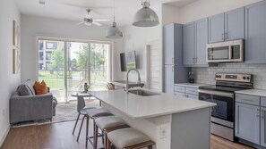 Fridge, dining tables - Landing | Chic 1BD, Pool, Gym (Austin)
