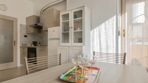A modern kitchen with a dining area. - The Billiards Flat by Wonderful Italy (Turin)