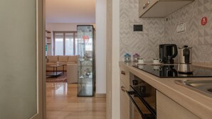 A modern kitchen with a built-in oven and a coffee maker. - The Billiards Flat by Wonderful Italy (Turin)