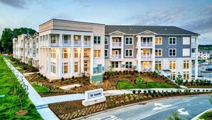 A multi-story residential building with a sign reading "THE MASON." - Landing | Modern 1BD, Pool, Yoga Studio (Indian Land)