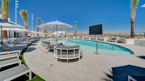 A pool area with lounge chairs, umbrellas, and a bar area. - Landing | Chic 2BD, Gym, Clubhouse (Spring Valley)