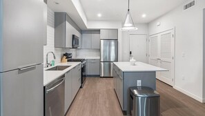 Fridge, dining tables - Landing | Stunning 2BD, Rooftop Lounge, Gym (Spring Valley)