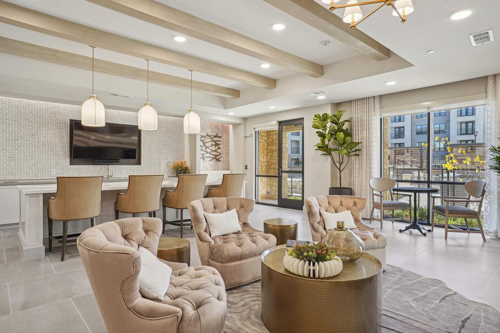 A modern living room with a sofa set, a coffee table, and a dining area with chairs and a table.