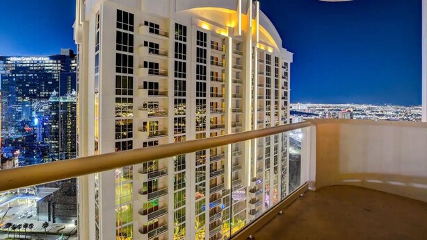 A high-rise hotel with multiple balconies and a city view. - F1 View + Strip Views, 34th Floor at MGM Signature (Las Vegas)