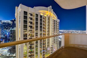 A high-rise hotel with multiple balconies and a city view. - F1 View + Strip Views, 34th Floor at MGM Signature (Las Vegas)