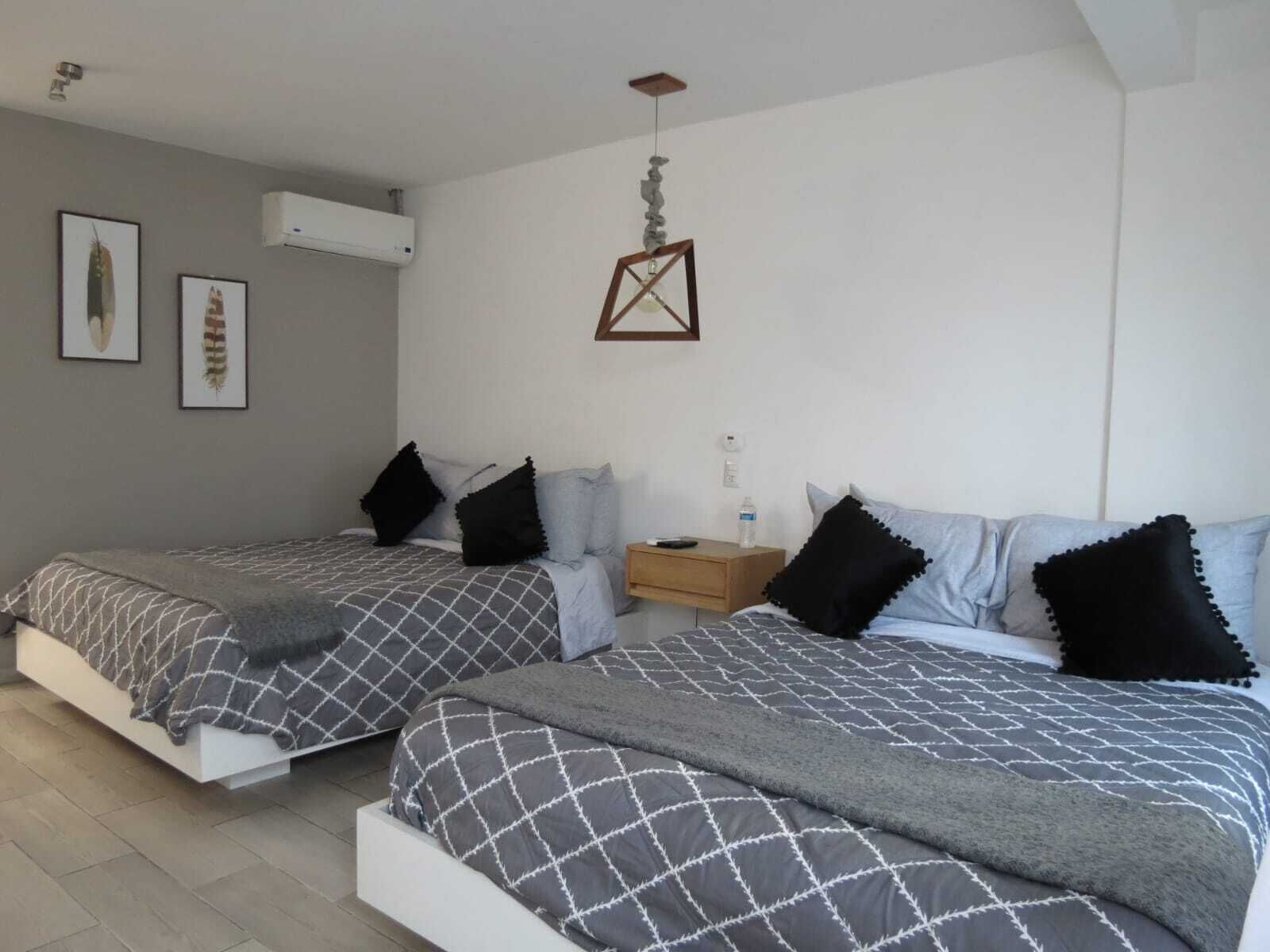 Family Triple Room, Garden View | Blackout drapes, iron/ironing board, free WiFi