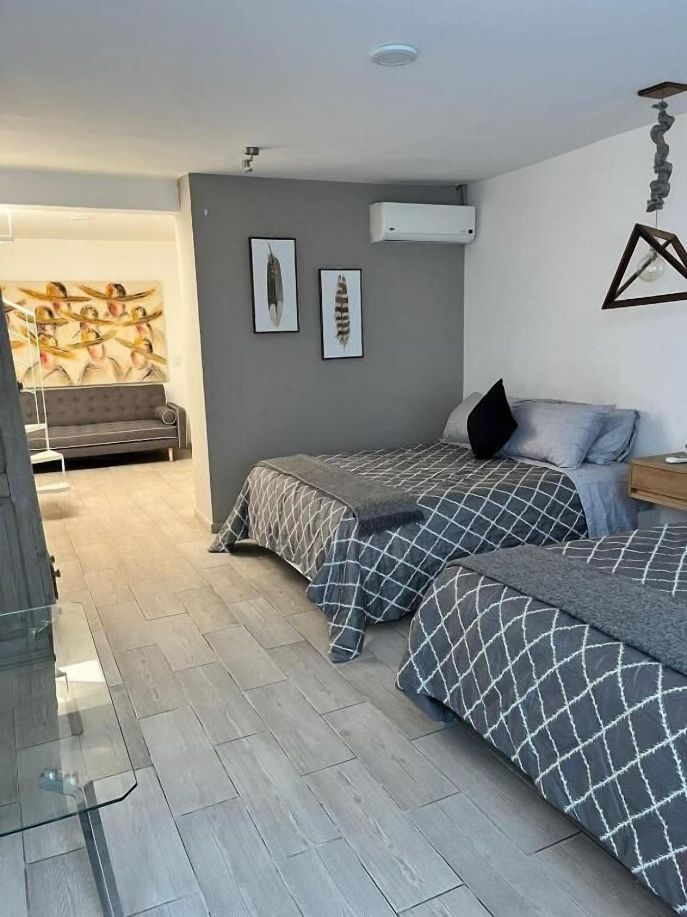 Family Triple Room, Garden View | Blackout curtains, iron/ironing board, free WiFi