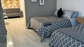 Family Triple Room, Garden View | Blackout curtains, iron/ironing board, free WiFi