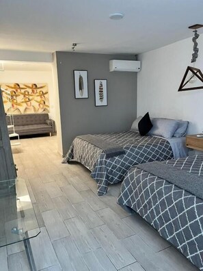 Family Triple Room, Garden View | Blackout curtains, iron/ironing board, free WiFi - NIDO Hotel (San Miguel de Allende)