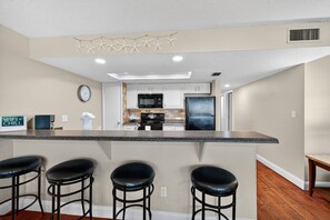 Fridge, microwave, oven, stovetop - Updated 3BR Condo with Intracoastal Views & Private Beach Access (Indian Shores)