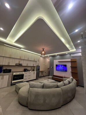 Comfort Apartment, Balcony, City View | Living area - Dim De Lights (Jinja)