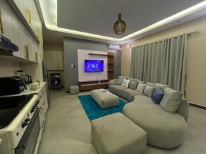 Comfort Apartment, Balcony, City View | Living area - Dim De Lights (Jinja)