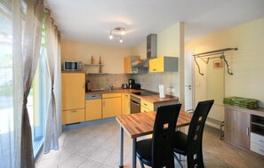 Fridge, stovetop, dishwasher, coffee/tea maker