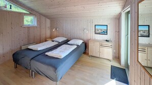 A room with a bed, a desk, and a window with a view of a marina. - 3 bedroom awesome home in Tarm (Tarm)