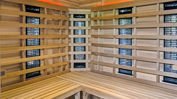 A sauna with wooden walls and benches, featuring multiple small windows. - Beautiful home in Paasloo with sauna (Paasloo)