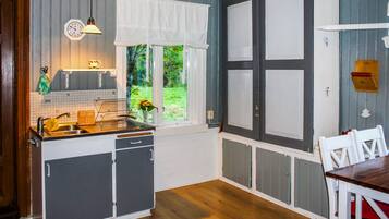 Fridge, microwave, stovetop, coffee/tea maker