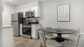 Fridge, dining tables - Landing | Stylish 2BD, Gym (Dunedin)