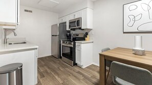 Fridge, dining tables - Landing | Chic 1BD, Gym (Dunedin)