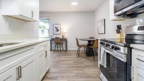 Fridge, dining tables - Landing | Chic 1BD, Gym (Dunedin)