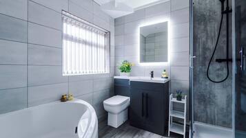 Shower, hair dryer, towels, shampoo