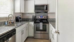 Fridge, dining tables - Landing | Stunning 2BD, Tennis Court, Pool (Raleigh)