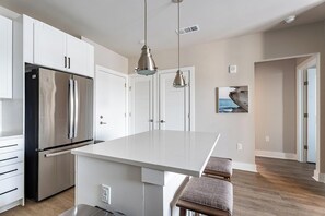 Fridge, dining tables - Landing | Stylish 1BD, Gym, Yoga Studio (Savannah)