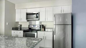 Fridge, dining tables - Landing | Stylish 2BD, Gym, Tennis Court (Raleigh)