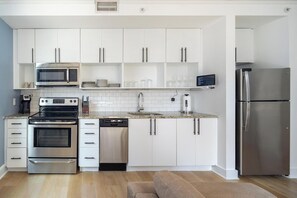 Fridge, dining tables - Landing | Spectacular 1BD, Gym, Game Room (Kansas City)