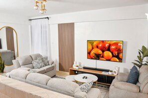 Smart TV, books, stereo - Maison Zury Thome | Cozy Executive 1BR | WiFi , Workspace |open canopy balcony (Nairobi)