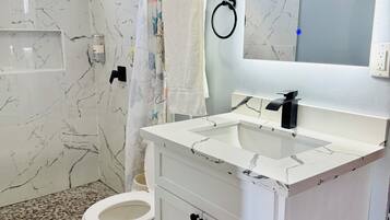 Shower, towels, soap, toilet paper