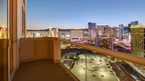 A balcony with a city view at dusk. - 30th Floor Strip Views MGM Signature (Las Vegas)