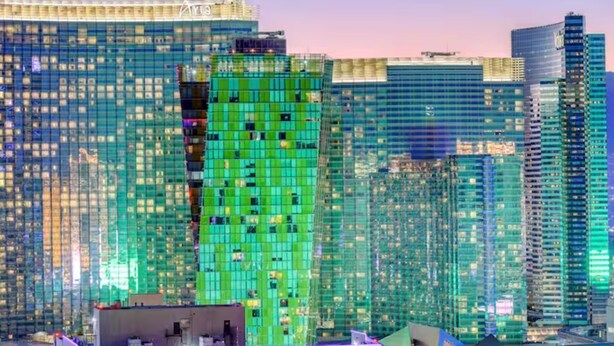 A high-rise building with a distinctive green facade and multiple windows. - 30th Floor Strip Views MGM Signature (Las Vegas)