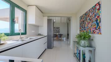 Apartment, 1 Bedroom, Smoking, Pool Access | Private kitchen | Coffee/tea maker, high chair, cookware/dishes/utensils