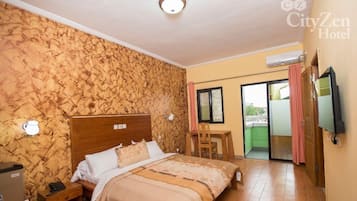 Deluxe Suite, Balcony, City View | Blackout drapes, iron/ironing board, free WiFi