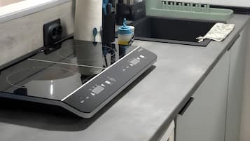 Fridge, microwave, stovetop, coffee/tea maker