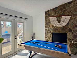 The game room is designed for fun, offering a full-sized billiards table and poker/card table, creating the ideal space for family or friends to gather and compete. - Beach Ya To It! Private Pool, Hot Tub, + Game Room! (Panama City Beach)