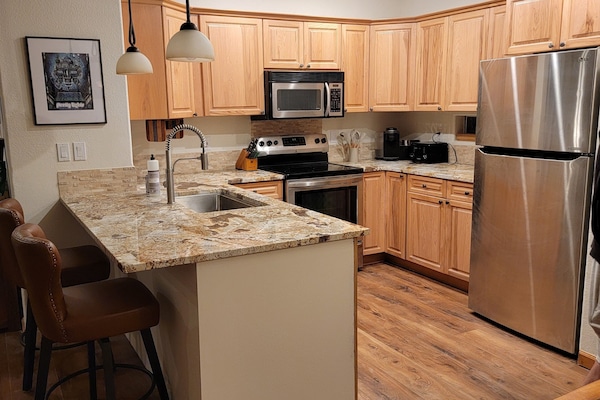 Brand new kitchen, new floors, countertops, dishwasher and fridge-fully stocked!