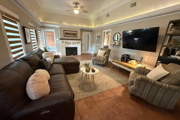 55-inch Smart TV with digital channels, fireplace, smart speakers