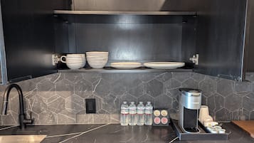 Deluxe Suite, 1 King Bed, City View | Private kitchen | Mini-fridge, microwave, dishwasher, cookware/dishes/utensils