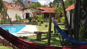 Outdoor pool, open 8:00 AM to 8:00 PM, pool loungers