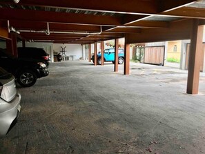A covered parking area with concrete flooring and metal beams. - Centrally located Simpson bay 1bdr apt (1-2) (Simpson Bay)