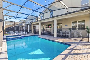 Outdoor pool, a heated pool - Spacious Kissimmee Home with Pool, Hot Tub, Game Room and Theater Near Disney (Kissimmee)