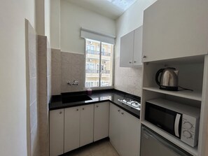 Studio, 1 Double Bed, Balcony, City View | Private kitchenette | Mini-fridge, microwave, stovetop, electric kettle