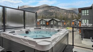 A hot tub on a balcony with a mountain view. - Chalet Grande Ourse | Slope-Side | Private Hot Tub (Panorama)