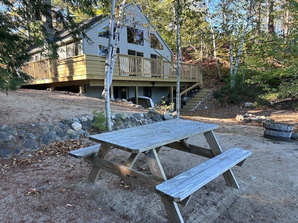 Awesome views with large windows facing the lake & picnic area on the beach