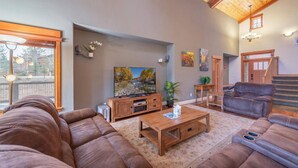 A spacious living room with a large television, comfortable seating, and a wooden coffee table. - 4 BR / 3.5 BA Home Near Downtown Truckee & Skiing! (Truckee)