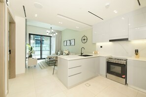 Fridge, microwave, oven, stovetop - Chic 1BR with Private Terrace & Burj Khalifa Skyline View | 4 Guests (Dubai)